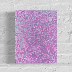 a pink and purple abstract painting on a white brick wall