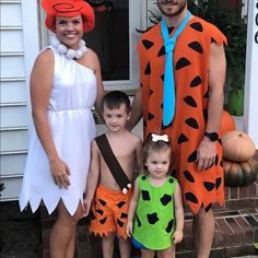 the family is dressed up in costumes for halloween