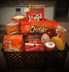 a basket filled with lots of food and drinks