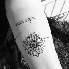 a woman's arm with a sunflower tattoo on it that says, you are my sunshine