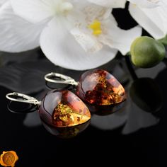 "\"Shoot for the Amber Moon. Even if you miss it, you will land among the stars.\" This pair of dazzling Amber Moon earrings beholds perfectly crafted cognac Baltic Amber set in 925 Hallmarked Silver. Lever-back closure ensures a secure and comfortable fit. Smooth, shiny and glossy. Handcrafted to a standard of perfection will make a meaningful nature-inspired gift or just another wonderful love token for yourself or your special someone. Presented in a luxury gift box. *Cognac Baltic Amber 40 - Amber Moon, Silver Cross Pendant, Love Token, Amber Earrings, Luxury Gift Box, Drop Dangle Earrings, Earrings Drop, Moon Earrings, Silver Drop Earrings