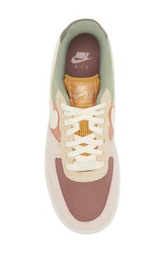 The basketball shoe that started a sensation keeps shooting and scoring as a street sneaker sporting layers of plush suede and colorblocked canvas. The iconic Air Force 1 sole features embedded Nike Air cushioning and crenellations along the tread that frame a star-studded bumper toe. Lace-up style Removable insole Leather, synthetic and textile upper/textile lining/rubber sole Imported Nordstrom x Nike: A curated lifestyle destination where fashion is the ultimate sport Sporty Cream Nike Air Force 1 For Casual Wear, Retro Beige Sneakers For Streetwear, Cream Nike Air Force 1 Sporty Sneakers, Sporty Nike Air Force 1 In Cream, Retro Cream Low-top Sneakers, Cream Nike Air Force 1 Sporty With Branded Insole, Nike Air Force 1 In Beige Sporty Style, Nike Air Force 1 Beige Sporty, Nike Air Force 1 Beige Sporty Shoes