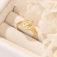 Introducing our stunning Gold Layering Signet Ring ✨, a captivating piece that embodies timeless elegance and modern style. With its intricate Starburst design ⭐, this Dainty Signet Ring brings a touch of celestial charm to your everyday look. Crafted with meticulous attention to detail, this Statement Ring is a true work of art. 🌟Gold Layering, Starburst Design, Dainty, Statement Ring, Gold Plated, Minimalist Signet Ring. 🌟 Luxurious and eye-catching, this Gold Plated Ring effortlessly captur Luxury Star-shaped Wedding Rings, Star-shaped Birthstone Jewelry For Promise Ring, Gold Celestial Signet Ring For Wedding, Star-shaped Diamond Jewelry For Promise, Elegant Star-shaped Signet Ring For Gift, Gold Celestial Diamond Ring, Celestial Style Birthstone Ring, Anniversary Jewelry Ring With Compass Design, Celestial Gold Jewelry With Vs Clarity