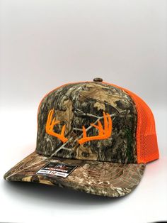 One of the most popular hats in the world, the Richardson 112, embroidered with a Deer Antlers. The Richardson 112 features a snapback closure and a mesh back. Available in several different hat colors and thread colors. We offer either the Richardson 112 in many colors or the Yupoong 6606 in greeen camo, both hats are snapback a one size fits all! Hunting Hats, Buck Antlers, Cattle Tags, Popular Hats, Leather Engraving, Camo Hat, Hunting Hat, Deer Hunter, Different Hats