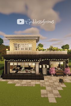 an image of a small restaurant in the middle of a field with trees and flowers