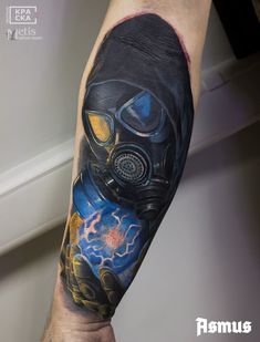 a man with a gas mask tattoo on his arm