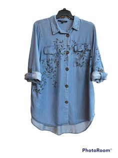 Love this button down shirt - good feel. Sleeves can be worn down or up to make a 3/4 sleeve. Painted with dye, vines flow nicely from the back to the front along one sleeve. Size 1X Spring Washed Button-up Blouse, Spring Washed Long Sleeve Blouse, Long Sleeve Washed Blouse For Spring, Spring Long Sleeve Washed Blouse, Spring Washed Button-up Shirt, Long Sleeve Washed Shirt For Summer, Painted Vines, Jeans Button, Blue Jean