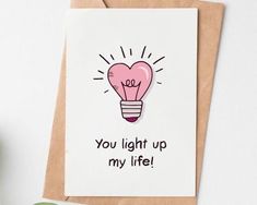 a card with an image of a light bulb on it and the words, you light up my life