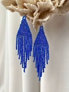 Hand-stitched bright blue earrings made with 100% Czech glass beads. Shining beaded earrings make an excellent personalized gift for bridesmaids, birthdays, Valentine's Day, Wedding day, Christmas, New Year, and others. ♡ Bead Length - 3.5'' (9 Centimeters) ♡ Total Length - 3.9'' (10 Centimeters) ♡ Width - 0.8'' (2.5 Centimeters) ♡ Quality Czech beads ♡ Stainless steel mounts If you like these dangle fringe earrings but would like them in a different color or size please email me and I do a spec Cheap Blue Bohemian Chandelier Earrings, Blue Beaded Fringe Dangle Earrings, Blue Beaded Tassel Dangle Earrings, Blue Dangle Earrings With Beaded Fringe, Blue Beaded Fringe Drop Earrings, Elegant Dangle Chandelier Earrings With Tiny Beads, Elegant Blue Tassel Earrings With Beaded Fringe, Blue Beaded Tassel Drop Earrings, Beaded Fringe Chandelier Earrings For Party