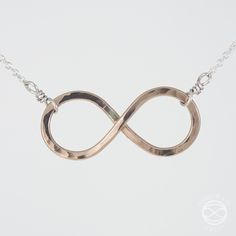 A hand formed and forged infinity symbol in 14k gold fill or Argentium Silver, featuring a fine chain and an elegant handmade clasp. The necklace is adjustable from 14 to 18 inches for a perfect placement right where you like it. Infinity symbol measures one inch across. Choose from Silver, Gold, or two-tone. Infinity Necklace Gold, Victorian Pendants, Santa Fe New Mexico, Casual Jewelry, Infinity Necklace, Infinity Symbol, Argentium Silver, Accessories Diy Jewelry, Silver Jewelry Handmade