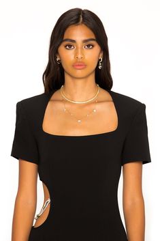 Feel chic in The Zoe Dress. Featuring a long hem, bold shoulders, and sexy side cut out with a diamond chain detail. Pair with statement jewelry and heels for the ultimate look, day or night. Elegant Body Chain For Night Out, Elegant Chain Dress For Night Out, Elegant Evening Dress With Chain Detail, Evening Body Chain With Chain Strap, Elegant Gold Body Chain For Night Out, Black Body Chain With Chain Strap For Night Out, Elegant Black Body Chain For Evening, Glamorous Fitted Body Chain For Evening Events, Glamorous Fitted Body Chain For Evening