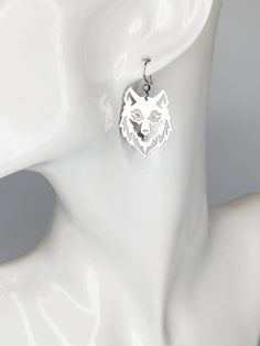 Intricately cut stainless steel wolf charms. Stainless steel Hooks Sterling Silver Jewelry With Wolf Design For Gift, Symbolic Silver Wolf Design Jewelry, Silver Stainless Steel Wolf Jewelry, Wolf Earrings, Sterling Silver Wolf Necklace, Charms, Stainless Steel