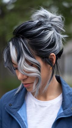 Silver and gray highlights on black hair create a stunning visual effect, adding depth and shine to your hairstyle. This modern color combo offers a sleek, sophisticated look that's perfect for any season. Get ready to turn heads with this bold, stylish choice! #BlackHairWithHighlights #SilverAndGrayHair #ChicHairstyle Grey Hair With White Money Piece, Gray Hair With Black Lowlights, Black With Grey Hair, Gray Underdye Hair, White Balayage On Dark Hair, Dark And Silver Hair, Platinum Blonde With Brown Highlights, Grey Hair Color Highlights, Dark Gray Hair Color Ideas