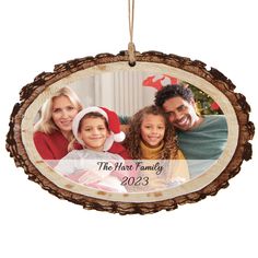 a family ornament hanging on a christmas tree