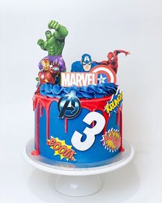 a birthday cake decorated with the avengers symbol