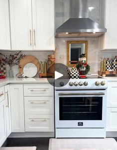 a white stove top oven sitting inside of a kitchen