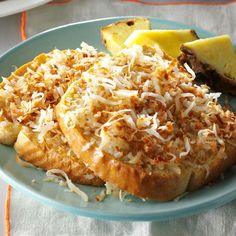 a blue plate topped with bread covered in toppings