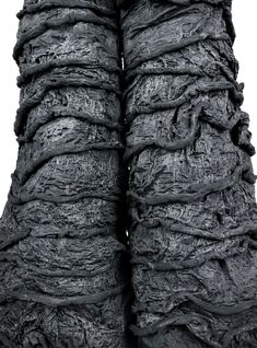 the back side of a woman's pants with ruffles on it and black fabric