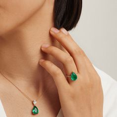 Perfect for a dipped neckline, our Emerald Drop Necklace from our Envy collection is the ultimate accent. The 925-sterling silver chain is plated with 14K gold for a sophisticated style, its dainty profile the ideal showcase for the tear drop-shaped emerald fusion stone pendant. A small, inverted tear-shaped cubic zirconia adds more shimmer and contrast leading to the emerald for a regal piece that will turn heads. Metal: 925 Silver Plating: 14K Gold E-coated Length: 16"+ 2" Extension Stone: Eme 925 Sterling Silver Chain, Drop Necklace, Stone Pendant, Tear Drop, Sophisticated Style, Stone Pendants, Sterling Silver Chains, Silver Chain, 925 Silver