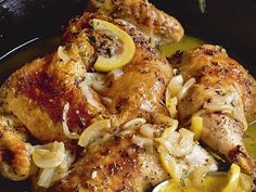 chicken with onions and lemons in a skillet