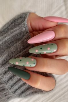 The almond-shaped nails embrace a playful combination of soft pink and sage green hues. Accentuated with pink and green polka dots, this design blends creativity with a touch of whimsy. Perfect for late February and early March trends, this look is versatile and can be achieved using DND gel polish for a vibrant and durable finish. March Nails Ideas Spring, Trending Summer Nails 2024, Spring 2024 Nails, Nails 2024 Trends, April Nails Ideas Easter, Nails For April, 2024 Nail Trends, Matte Spring Nails, Nails April