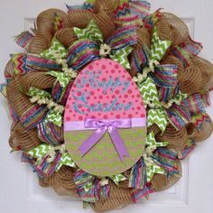 a wreath with a happy easter egg on it