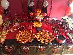 a table topped with lots of food and desserts