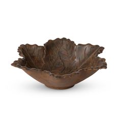 a brown leaf shaped bowl on a white background