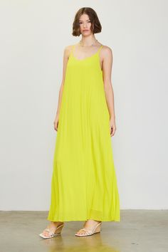 Simple yet striking, this strappy maxi dress has a loose, languid silhouette of flowing pleats that drop to the floor. It's accented by a slim strap that crosses the back. •Adjustable spaghetti straps •Pleated •Strap detail at back •Maxi length Item Number: 99187 100% POLYESTER Lime Yellow, Strappy Maxi Dress, Pleated Maxi Dress, Pleated Maxi, The Floor, Item Number, Spaghetti Strap, Spaghetti, Maxi Dress