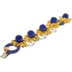 Be enthralled by the symphony of exquisite materials and masterful craftsmanship in the David Webb Platinum & 18K Yellow Gold Rock Crystal Lapis Floral Style Bracelet. This striking piece of jewelry from David Webb is a true testament to the brand's expertise in design and luxury. Crafted with a combination of platinum and 18K yellow gold, this bracelet exudes timeless elegance and sophistication.What sets this bracelet apart is its unique composition of materials. Three carved oval rock crystal links showcase translucence and light play, adding a mesmerizing quality to the piece. Complementing these are two circular carved round lapis lazuli links that bring a deep, rich blue hue, creating a stunning contrast against the gold and crystal elements.Adding to its allure are five carved teard Luxury Intaglio Jewelry For Evening, Luxury Ceremonial Bracelets, Elegant Blue Bracelets For Evening, Elegant Blue Evening Bracelets, Royal Gold Jewelry For Formal Occasions, Yellow Gold Intaglio Bracelet For Formal Occasions, Formal Yellow Gold Intaglio Bracelets, Formal Yellow Gold Intaglio Bracelet, Elegant Yellow Gold Bracelet With Intaglio