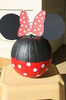 a minnie mouse pumpkin sitting on top of a chair