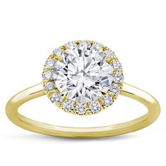 a yellow gold engagement ring with an oval diamond center