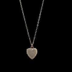 Heart lockets have a long history and are cherished for their romantic symbolism and as keepsakes for loved ones. This charming locket is fully hand engraved, with a delicately engraved border . Handcrafted in 14k yellow gold Locket measures 11mm x 10mm Featured on a new 16" 14k small round link chain with a secure lobster clasp Because we do all our restoration work by hand, we can offer a huge array of customization. If you have inquiries about sizing, alterations, or engraving, you can inquir Classic Engraved Heart Shaped Locket Necklace, Antique Engraved Locket Necklace For Gift, Antique Engraved Locket Necklace For Keepsake, Antique Gold Engraved Locket Necklace Keepsake, Antique Mens Jewelry, Heart-shaped Engraved Brass Locket Necklace, Gold Locket, Long History, Tiny Heart