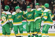 the hockey players are congratulating each other