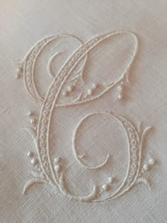 an embroidered monogram is shown on the fabric