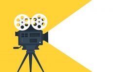 a movie camera on a tripod in front of a yellow and white background