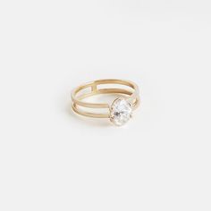 a gold ring with a single diamond on it