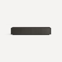 a black shelf sitting on top of a white wall