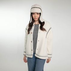 Stay stylish and snug this autumn and winter with our newest addition, the Dannika Trapper Hat. Perfectly matching our beloved Dannika Gilet, this hat is designed for the modern woman who values both fashion and comfort. Available in elegant Cream and classic Black, the Dannika Trapper Hat is your go-to accessory for those chilly days. Crafted with premium materials, this hat ensures warmth without compromising on style. The soft lining and chic design make it a must-have for your winter wardrobe. Whether you’re heading out for a brisk walk or a cozy coffee date, the Dannika Trapper Hat will keep you looking fabulous and feeling comfortable. 100% Polyester Dry Clean Cream Winter Hat, One Size Fits Most, Casual Cream Crochet Hat For Winter, Cream Hats For Cold Weather In Fall, Casual Winter Hats With Fleece Lining, Cream Bonnet For Winter, One Size, Casual Winter Hats One Size, Cream Crochet Cap For Winter, Casual Hooded Winter Hat, Casual Cream Bonnet