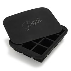 a black plastic box with compartments and the word peke written in cursive writing