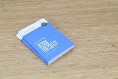 a blue book sitting on top of a wooden table