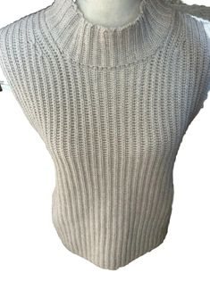 Elevate Your Wardrobe With This Designer Christophe Fischer Sleeveless Vest. Crafted From Luxurious Cashmere Fabric In A Tight-Knit Pattern, The Ribbed Accents Add Texture And Style To This Classic Fit Vest. The Collarless, Pull-Over Design Features A Mock Neck And Is Perfect For Layering Over A Blouse Or Shirt For A Travel, Casual, Workwear, Or Business Occasion. Carefully Crafted To Be Lightweight And Stretchy, This Sweater Is Perfect For All Seasons And Is Easy To Maintain With Dry Clean Only Winter Ribbed Vest, Beige Ribbed Sleeveless Sweater Vest, Winter Ribbed Sleeveless Vest, Winter Sleeveless Ribbed Vest, Ribbed Sleeveless Winter Vest, Beige Stretch Sweater Vest Sleeveless, Beige Stretch Sleeveless Sweater Vest, Nightmare Before Christmas Sweater, Neon Pink Sweater