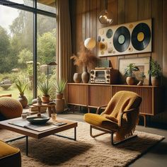 a living room filled with lots of furniture next to a large glass window and wooden paneled walls