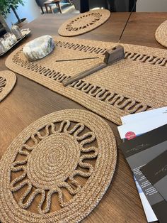 a wooden table topped with lots of place mats