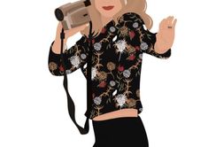 a woman holding a camera up to her face while wearing a black shirt with flowers on it