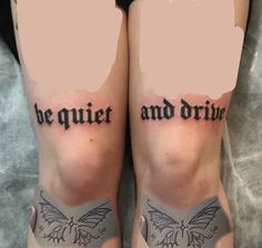 two people with tattoos on their legs that say be quiet and drive in black ink