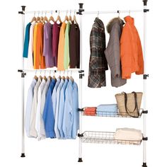 an organized closet with clothes and handbags hanging on the rack, including sweaters