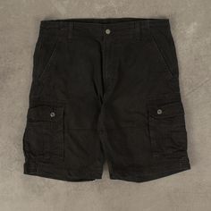 Men's Vintage Levi's Cargo Shorts  + Closure: Zip  + Colour: Black  + Size Label States: W36  + Actual measurements (inches): W34  + Measurements (Inches): Hem = 11, Rise = 12  Please note that all vintage items have been previously worn, and may show some signs of previous wear. However, any significant damage will be photographed and/or stated in the items listing. Please note that damage to the inside may not always be photographed or listed. Black Cargo Shorts With Patch Pockets For Streetwear, Black Cotton Cargo Shorts For Outdoor, Black Cotton Utility Cargo Shorts, Black Cargo Shorts With Patch Pockets, Black Cargo Shorts With Belt Loops For Outdoor, Black Shorts With Pockets And Short Inseam, Fitted Shorts With Pockets For Streetwear, Black Cotton Cargo Shorts With Multiple Pockets, Black Cargo Pants With Belt Loops