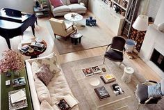 an aerial view of a living room with couches, chairs and coffee table in it