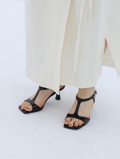 MOL:pin reinterprets rapidly changing trends through wearable designed shoes.- Soft and durable cow leather used- Trendy square shape toe line- Unique T-strap on the instep - Buckle strap on the ankle Formal Sandals With Penny Strap And Square Toe, Formal Square Toe Sandals With Penny Strap, Black Heels With Penny Strap, Sleek Black Square Toe Sandals, Black Single Toe Strap Sandals For Work, Black Sandals With Sculpted Heel And Square Toe, Square Toe Sandals With Heel Strap For Work, Square Toe Sandals For Work, Black Sandals With Buckle Closure And Square Toe